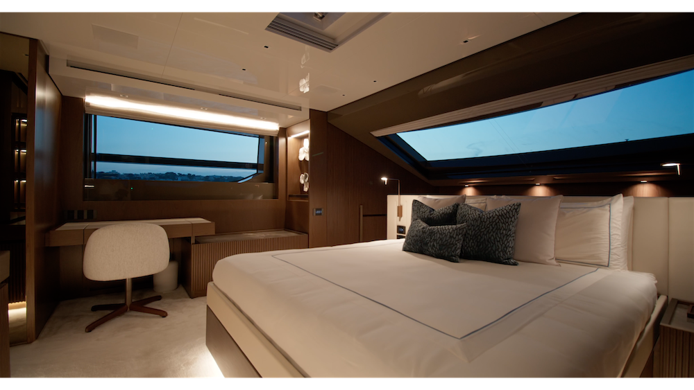 Large full beam cabin on a motor yacht with a double bed and vanity table